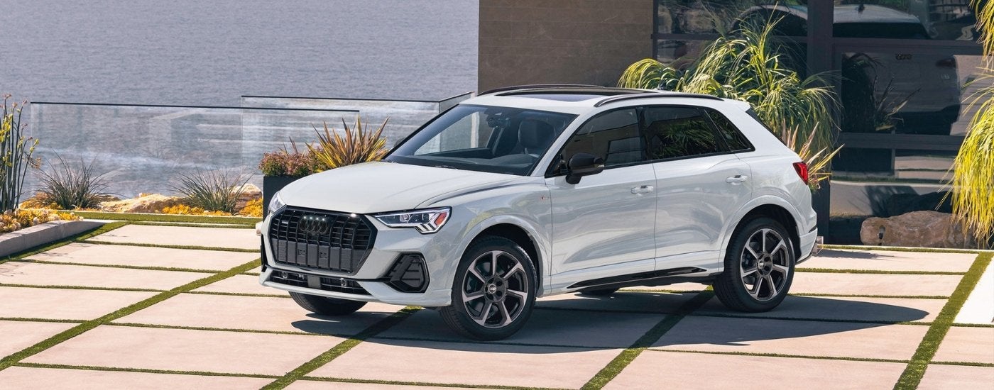 A white 2025 Audi Q3 for sale is shown from the front at an angle.